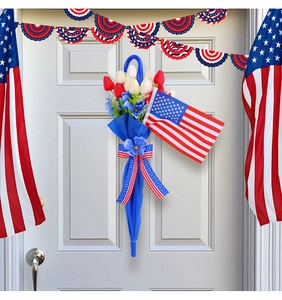 Detail of red and white tulips in a blue umbrella with an American flag door hanging