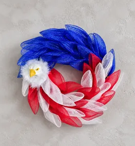 Close-up of patriotic eagle wreath with red white and blue mesh layers for wall decor