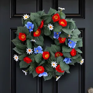 Independence Day wreath with red and blue flowers on a black front door decoration