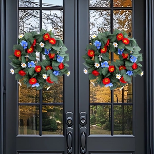 Set of two Independence Day wreaths with red blue flowers and green leaves on black doors