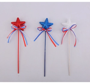 Close-up of Independence Day star wands set in red white and blue with ribbon bows