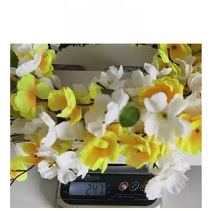 Detail showing the lightweight artificial flower wreath weighing approximately 247 grams