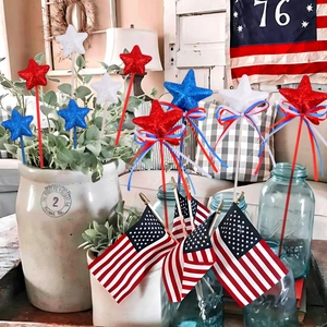 Patriotic July 4th star wands with red white blue ribbons and flags in a home setting