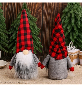 Detailed front and back view of red and black plaid Christmas gnomes on a wooden background
