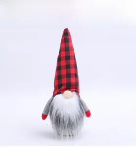 Close-up of a Christmas gnome doll featuring a red and black buffalo plaid hat and white beard