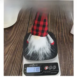 Detailed view of the 110g weight of this Christmas red plaid gnome decoration