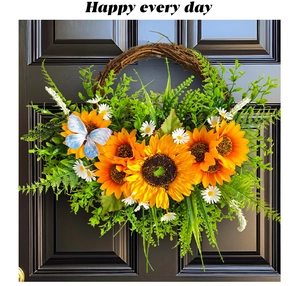 Detail of sunflower wreath on a dark door featuring a blue butterfly and natural vines