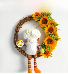 Couronne de gnome de fête avec tournesols et poupée de chef sur anneau de branche
