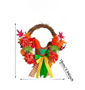 Detail view of autumn wreath with chicken, maple leaves, and pumpkin with measurements
