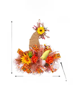Detailed harvest wreath view with gnome doll, sunflower accents and burlap ribbons