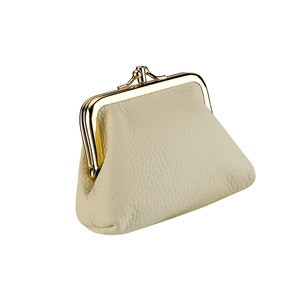 Detailed macro view of the cream lychee grain leather finish and golden kiss-lock closure
