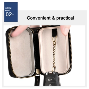 Detail of the leather car key case with metal chain and hook for secure storage