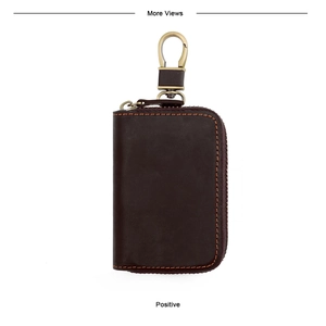 Positive view of deep brown leather car key case with fine stitching and bronze metal clip