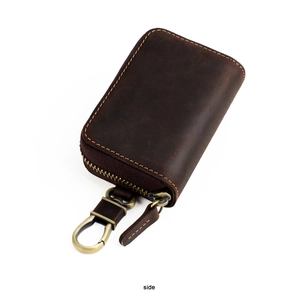 Side view of dark brown crazy horse leather car key case with vintage hardware