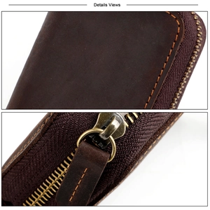 Detail of vintage brown crazy horse leather key case with fine stitching and metal zipper