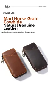Detail view of two vintage brown crazy horse leather zipper pencil cases with stitching