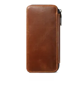 Detail view of the brown crazy horse leather pen case showing rear stitching and zipper