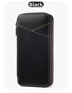 Detail of black crazy horse leather pen case featuring contrast yellow stitching and zipper