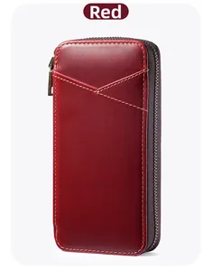 Detail of red crazy horse leather pencil case with yellow stitching and vintage zipper
