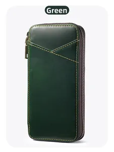 Macro shot of dark green crazy horse leather pen case with contrast yellow stitching