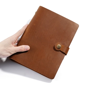 Vintage brown crazy horse leather A5 notebook cover with a rustic brass buckle closure
