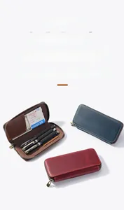 Close-up of crazy horse leather pen case interiors with card slots and zippers