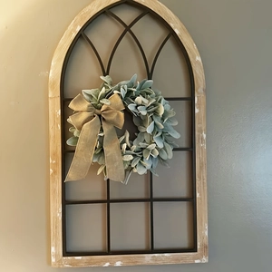 Rustic wooden window frame decor with artificial greenery wreath and burlap bow