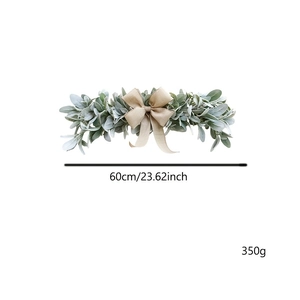 Detail of 60cm artificial eucalyptus greenery swag with a burlap bow for door decoration