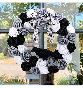 Detailed view of Gothic Halloween wreath with black roses and realistic crow model