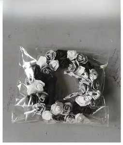 Detail of Halloween rose wreath with spider patterns packed in clear retail bag