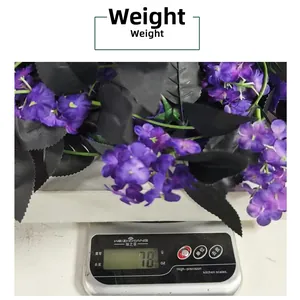Weight measurement of purple rose garland with black leaves showing 78g on a digital scale