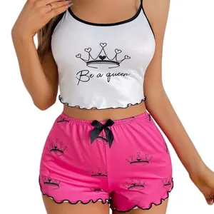 Two-piece pajama set with crown print camisole and matching ruffled shorts for women