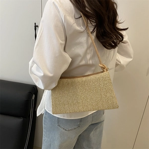 Straw shoulder bag for women with beige woven chevron pattern and minimalist boho style