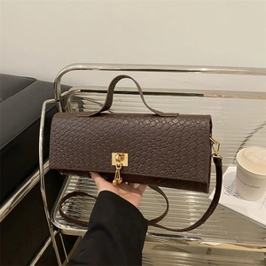 Fashionable dark brown woven bag with gold lock and adjustable strap in a minimalist style