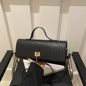 Chic black crocodile embossed baguette bag with golden metal lock and slender shoulder strap