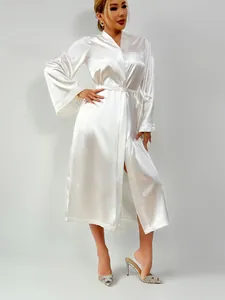 Detailed view of long sleeve white satin robe featuring premium silk texture and waist tie