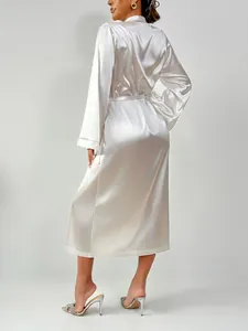 Detailed back view of a silver satin long robe with smooth silk texture and tie belt