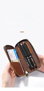 Interior detail of crazy horse leather pen case with slots for pens and cards
