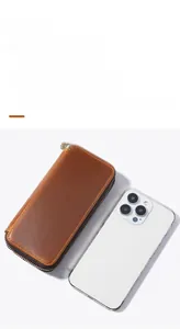 Brown crazy horse leather zipper pen case compared with a smartphone for size scale