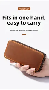 Handheld vintage brown leather zipper fountain pen case with contrast stitching details