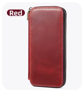 Detailed view of red crazy horse leather pen case with zipper and yellow stitching