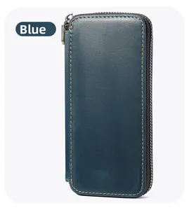 Detail of blue cowhide leather pen case with yellow stitching and metal zipper