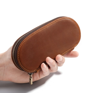 Handheld vintage brown crazy horse leather pen case with three slots and zipper closure