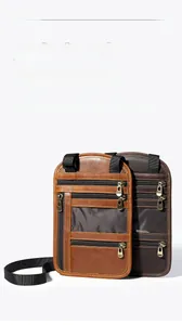 Detail view of two vintage leather neck pouches with multiple zippered compartments
