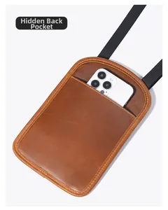 Brown leather passport bag with a hidden back compartment for smartphone storage