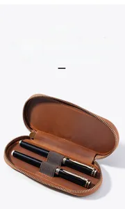 Macro shot of crazy horse leather double pen case with secure elastic loops