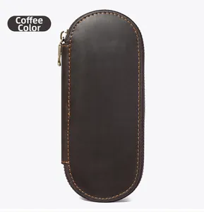 Detail of coffee brown crazy horse leather pen case with orange stitching and metal zipper