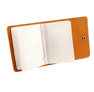Detailed view of brown leather card holder featuring transparent multi-slot card inserts