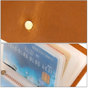 Detail of brown leather card holder featuring secure snap closure and clear multi-slots