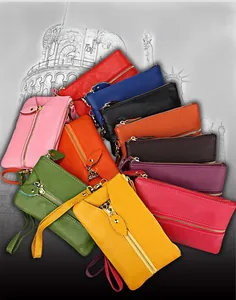 Collection of litchi grain leather coin purses in various colors with wrist straps